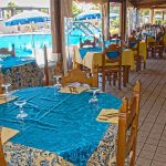Outdoor tables at Club Esse Cala Gonone Beach Village