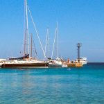 Boats moored at Cala Capra east of Palau