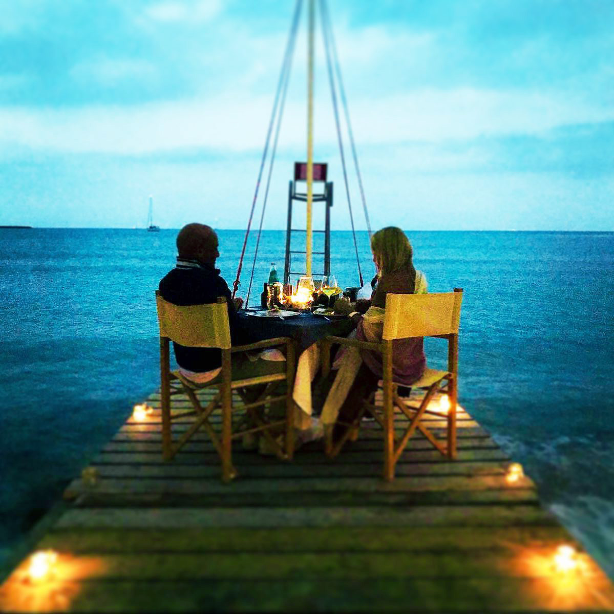 Romantic dinner on the bridge facing the sea