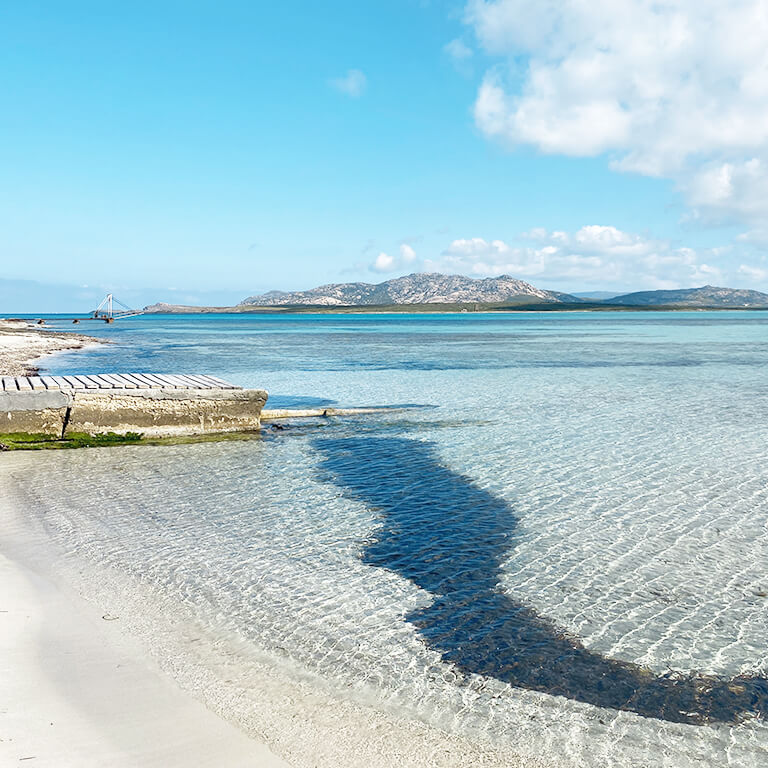 bridge-beach-la-pelosa-winter Little bridge with Asinara view and transparent sea